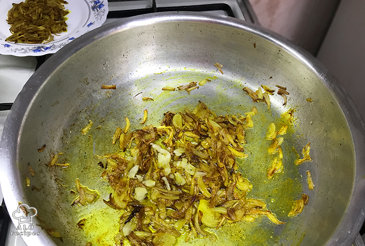 Add garlic to the remaining onions