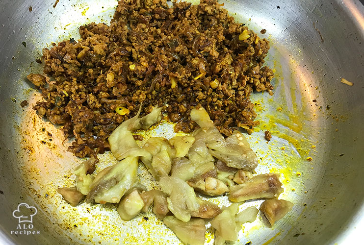 Add eggplant pieces to the ground beef