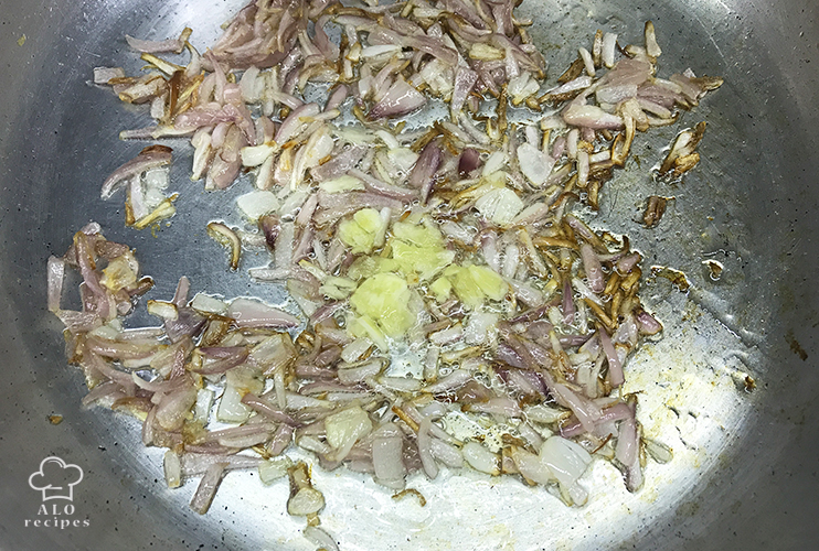 Add garlic to the onions