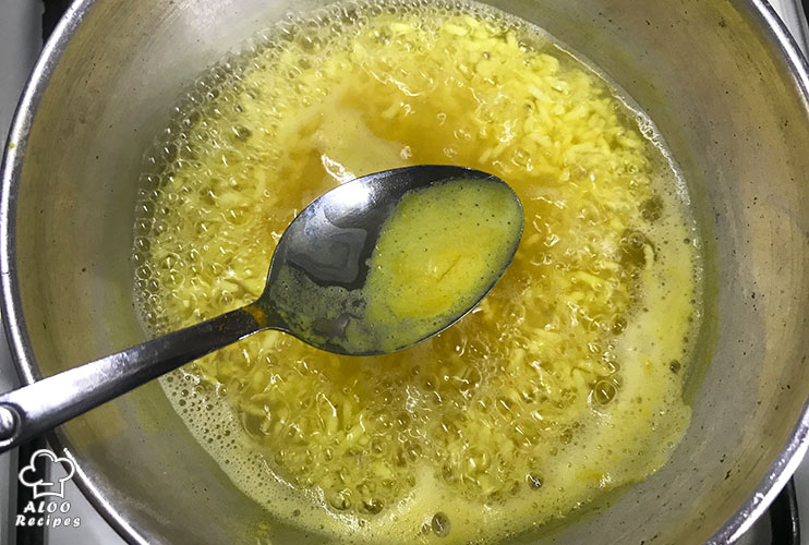 Add some turmeric to your boiling rice