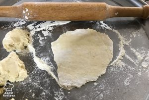 Roll out each piece of dough into a small round