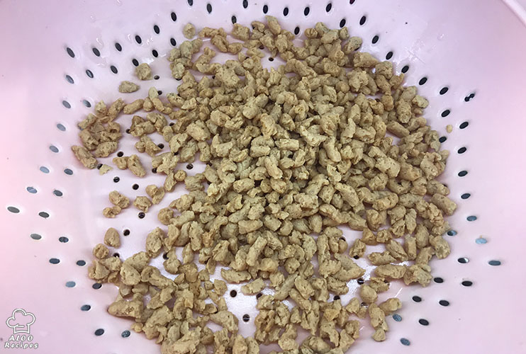 Pour the soy granule in a colander